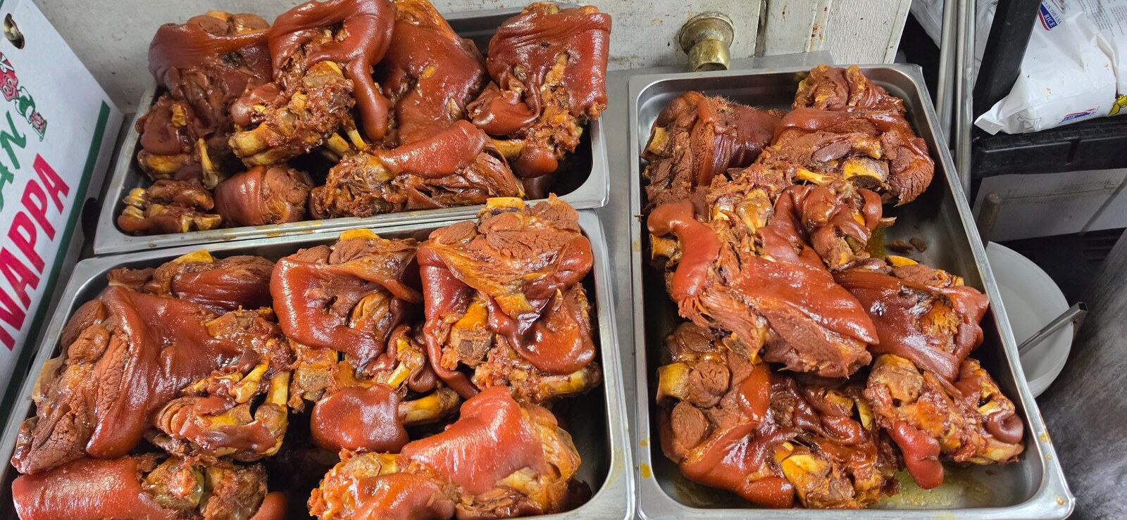 Freshly cooked JokBal resting in a stainless steel container in the JCDKR kitchen